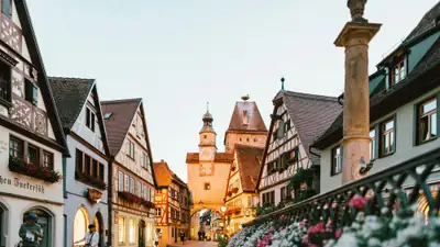 Half-timbered houses and flower boxes on a cobbled street in Rothenburg ob der Tauber, Germany
