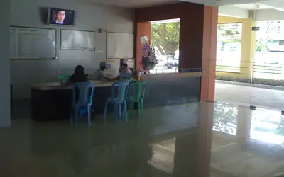 Patients waiting at the reception desk of a children's hospital in Yangon