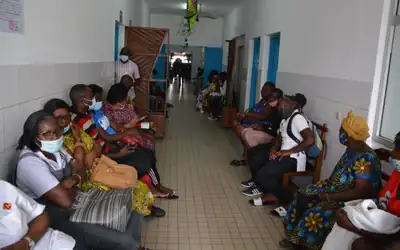 Patients waiting in an outpatient corridor at Laquintinie Hospital, Douala, Cameroon