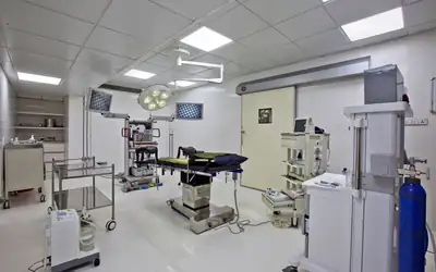 Laparoscopic operating theatre with surgical lights and monitors, India